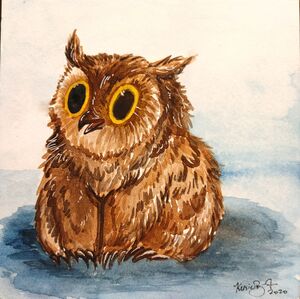 Delightful little owlbear cub looks pleased